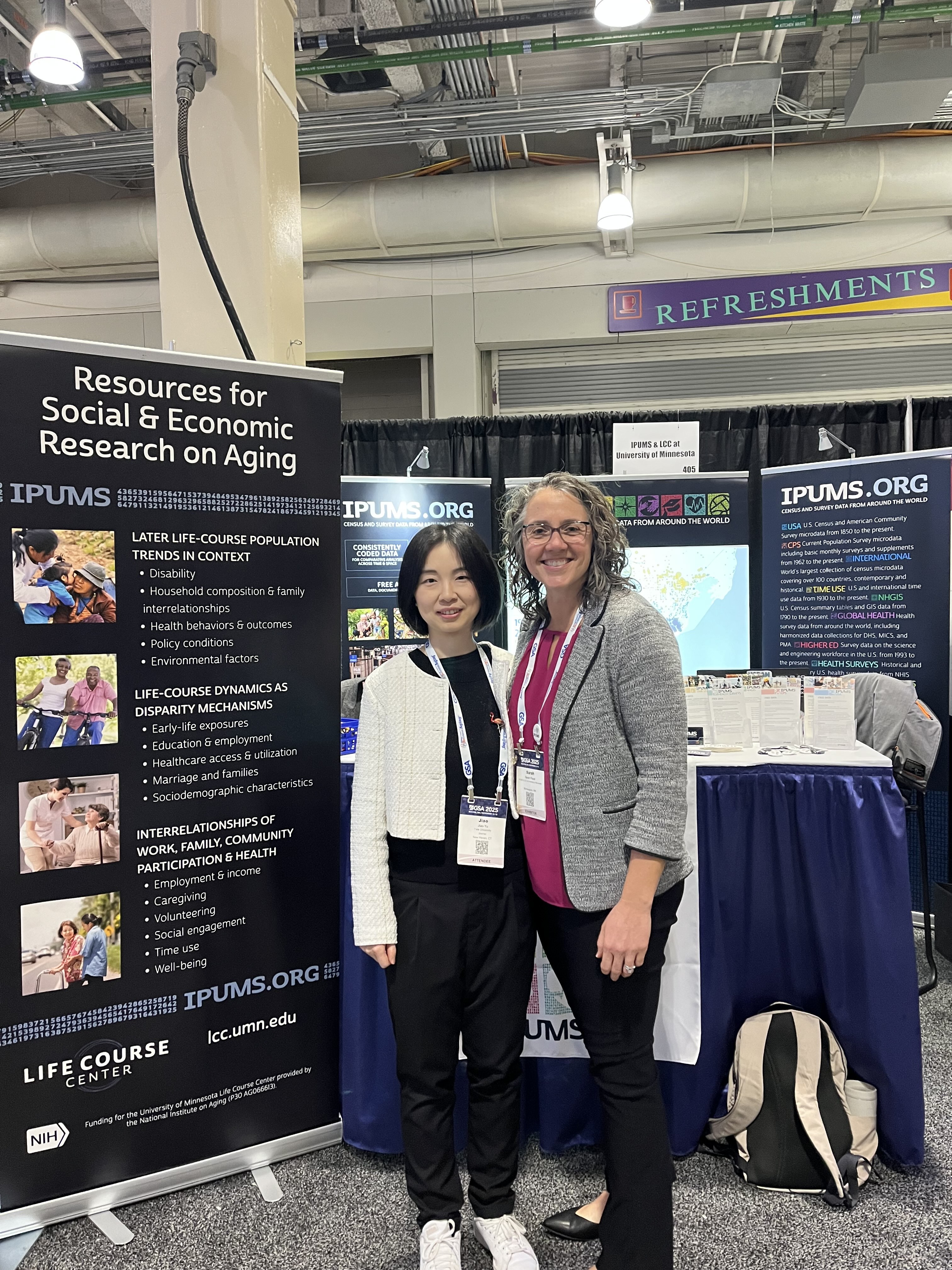 Two people at the IPUMS booth